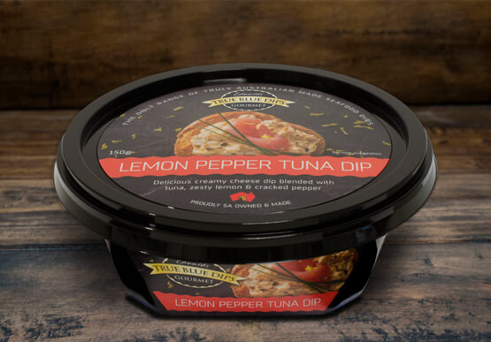True Blue Seafood Dips, Lemon Pepper Tuna Gourmet Dip in tub set on timber background scene.